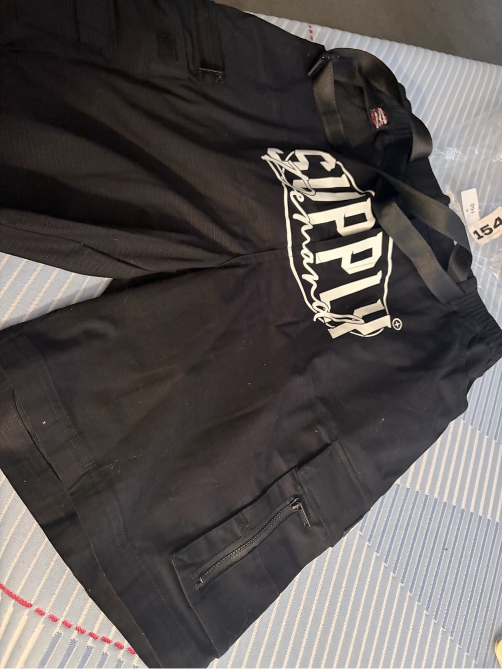 Black Cargo Shorts with White Script Logo